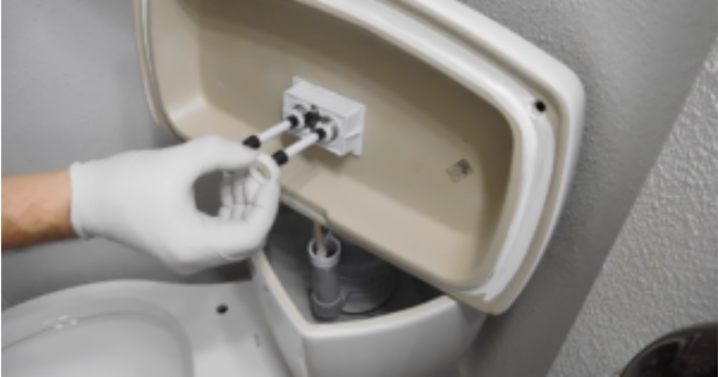 attaching flush mechanism to toilet tank lid