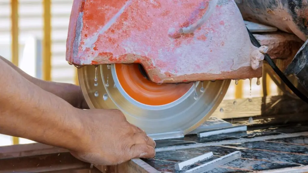 Tile saw cutting tile